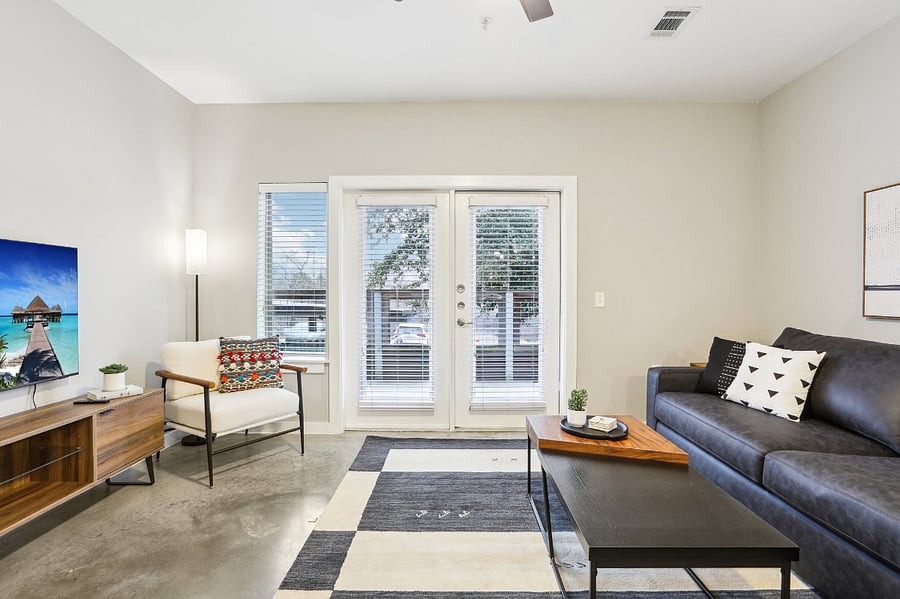 Living room and backdoor that goes to the large, private patio