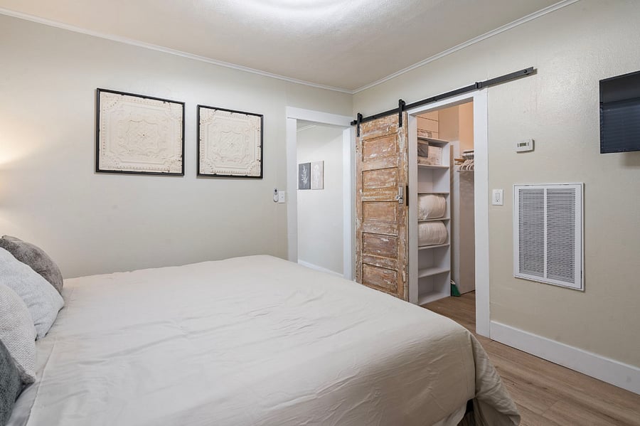 More storage in walk in closet with shelves. closet rod is equipped with 50 velvet covered hangers.