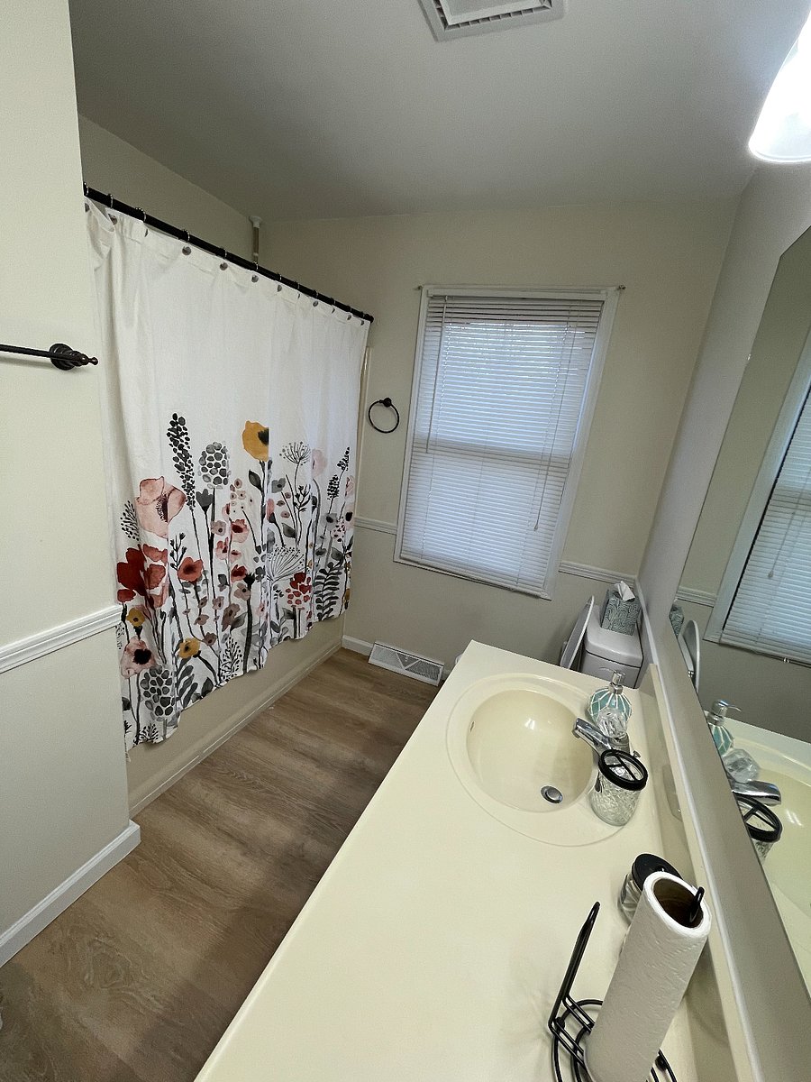 Shared bathroom with tub shower
