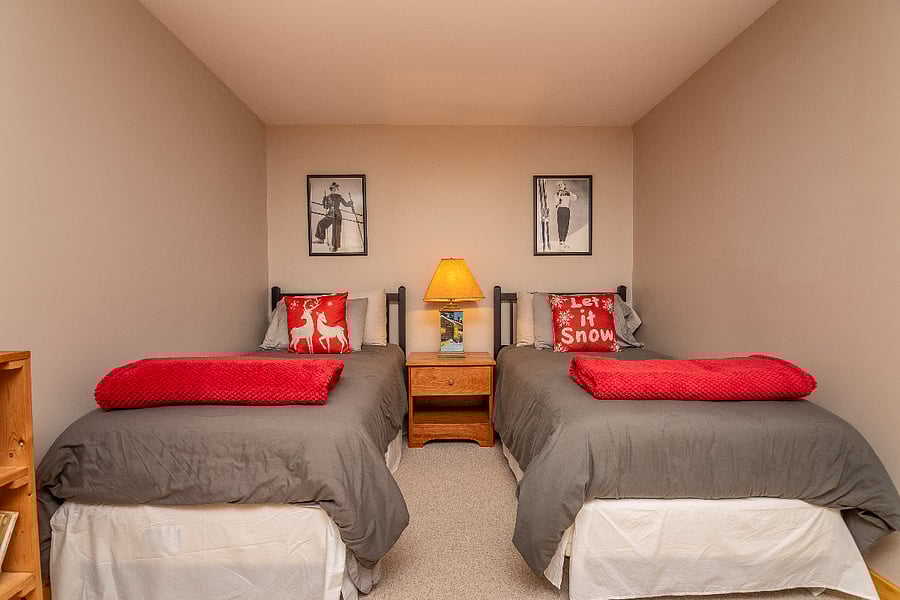Twin beds in bunk room.