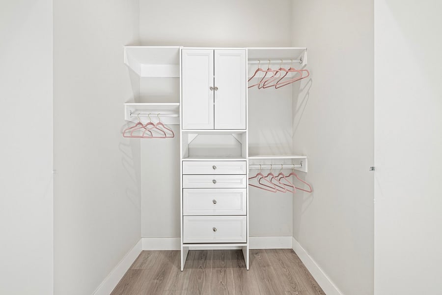 Step into luxury and organization with this full-size walk-in closet featuring beautifully organized cabinets. Your clothing and accessories deserve to be displayed in style!"