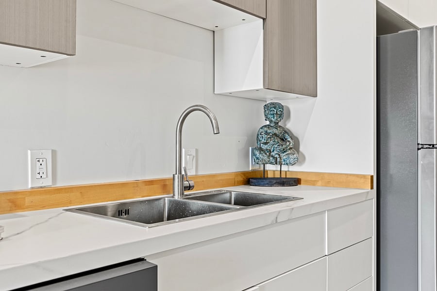 Spacious and bright kitchen area, perfect for cooking up delicious meals and creating lasting memories with loved ones. Plenty of room for culinary creativity to flourish!.