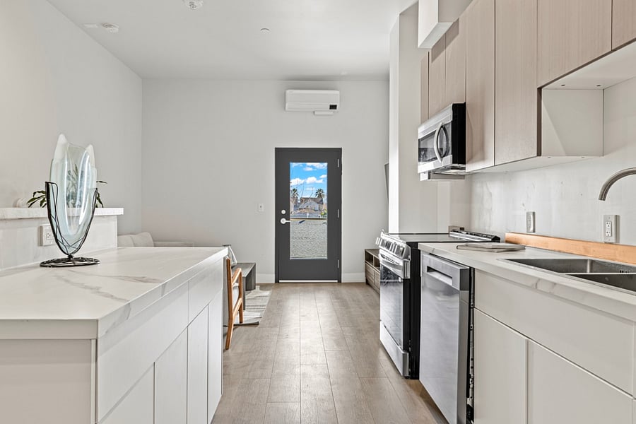 Spacious and bright kitchen area, perfect for cooking up delicious meals and creating lasting memories with loved ones. Plenty of room for culinary creativity to flourish!.
