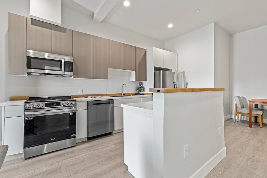 Spacious and bright kitchen area, perfect for cooking up delicious meals and creating lasting memories with loved ones. Plenty of room for culinary creativity to flourish!.
