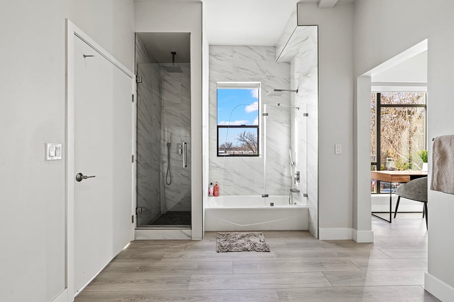 "Indulge in luxury with cast iron tub and rain shower - the perfect combination for a relaxing soak and rejuvenating shower experience."