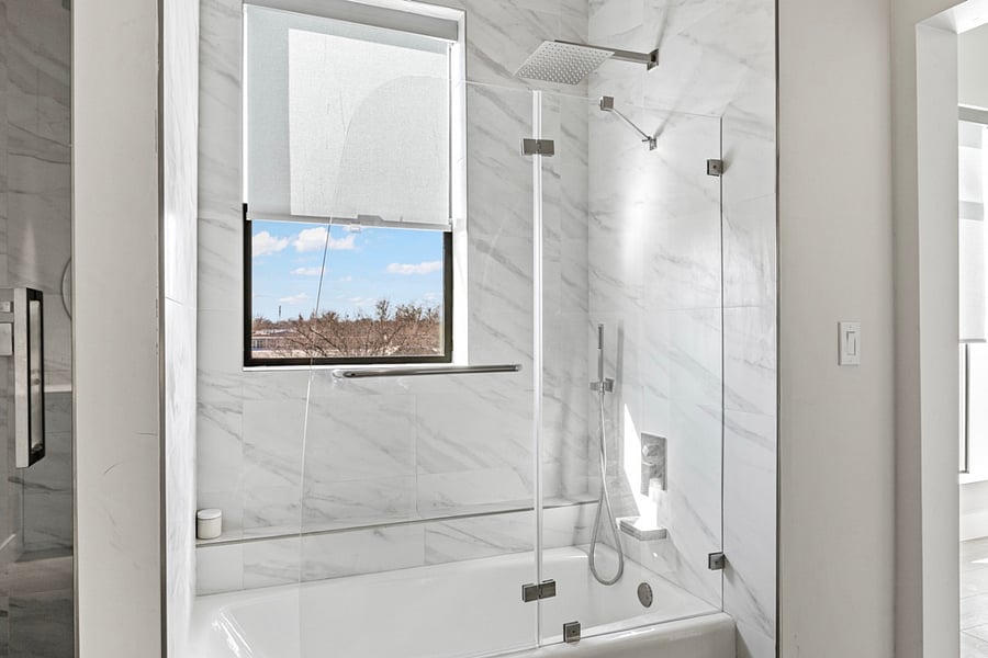 "Indulge in luxury with cast iron tub and rain shower - the perfect combination for a relaxing soak and rejuvenating shower experience."