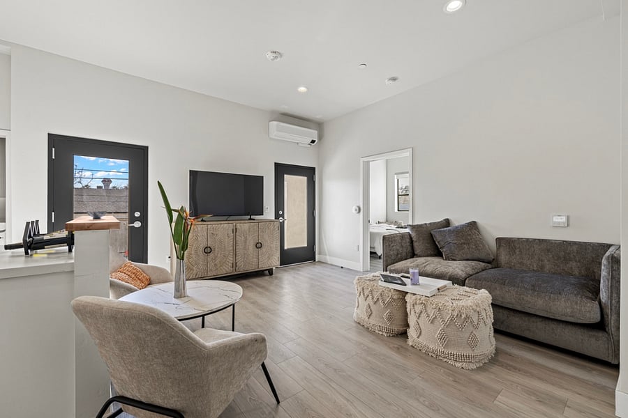 Step into a modern oasis of calm and relaxation in this beautifully designed living room space