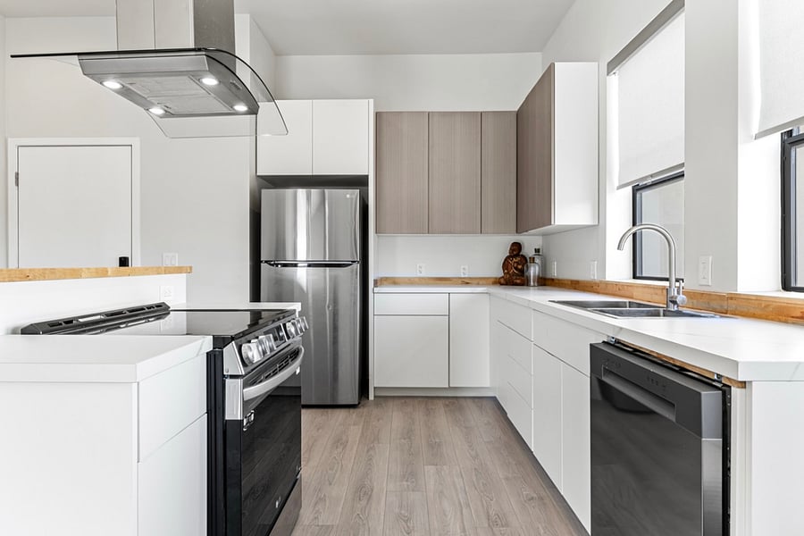 Spacious and bright kitchen area, perfect for cooking up delicious meals and creating lasting memories with loved ones. Plenty of room for culinary creativity to flourish!.