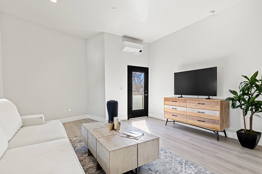 Step into a modern oasis of calm and relaxation in this beautifully designed living room space