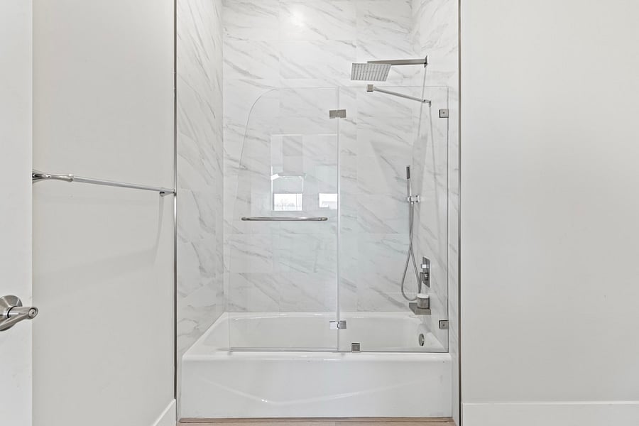 "Indulge in luxury with cast iron tub and rain shower - the perfect combination for a relaxing soak and rejuvenating shower experience."