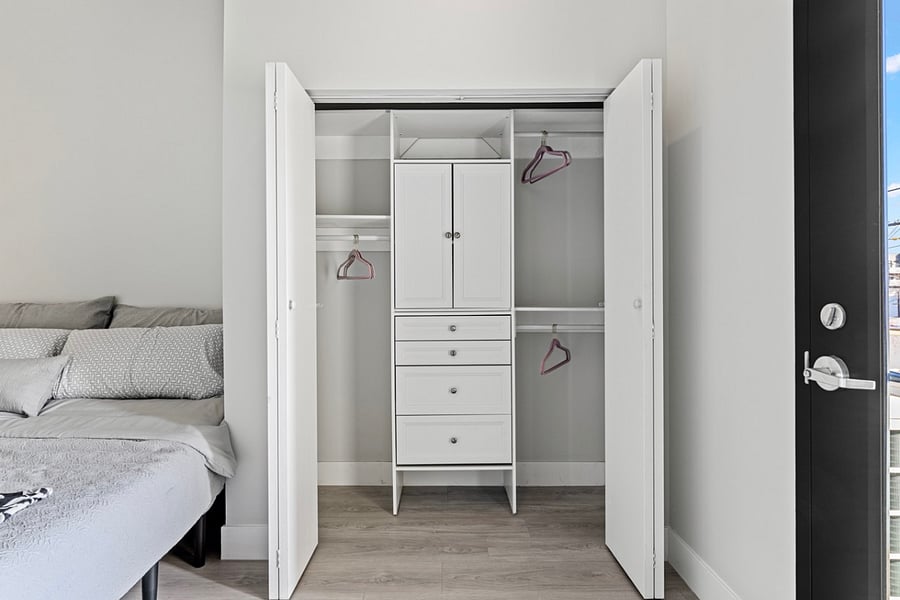 Step into luxury and organization with this full-size walk-in closet featuring beautifully organized cabinets. Your clothing and accessories deserve to be displayed in style!"