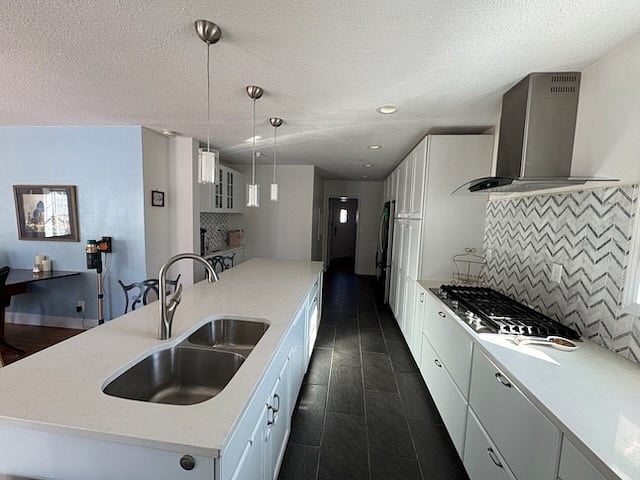 Large spacious kitchen with lots of light and pantry space. Dishwasher is conveniently in the island. Countertops are beautiful quartz white and grey.