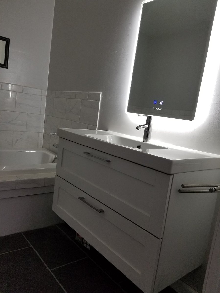 This floating vanity has lots of storage in both drawers. The mirror has touch lighting technology and is anti-fog.