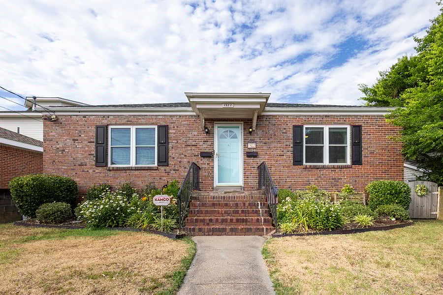 Front of house, entry with steps going up to porch.
