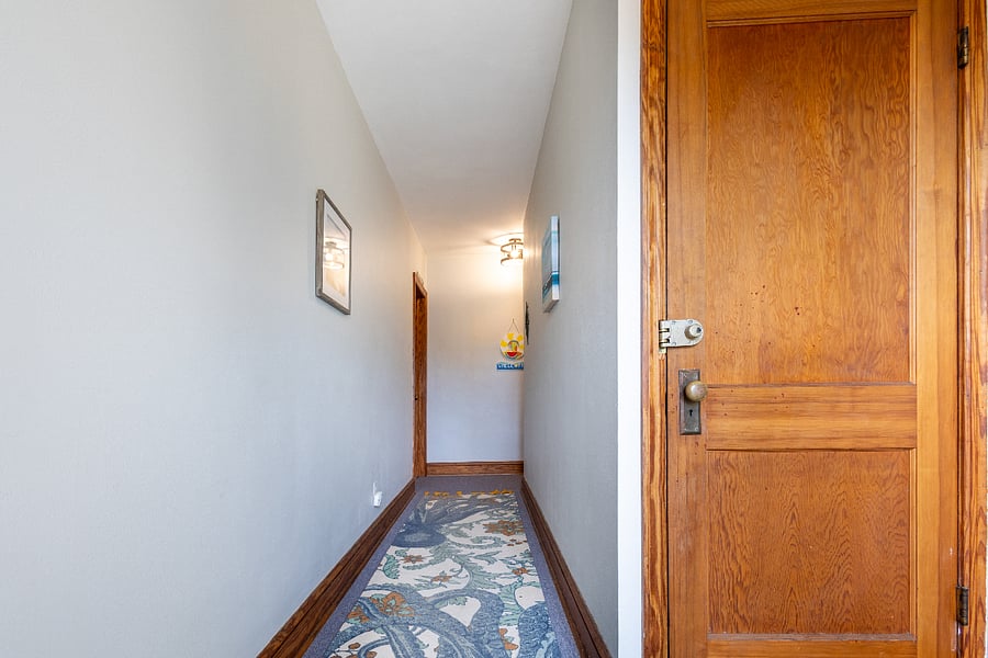 Entry into hallway from front door. Entry into unit is down the hallway with Unit A door on the left and Unit B door on the right. The door to the right is to the attic, no guest access in attic or basement.