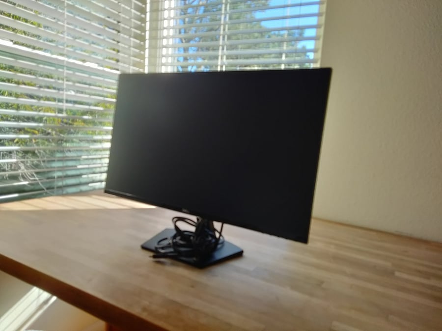 This large monitor connects to your laptop for an extra screen, cable provided. It is 24"x14", or 27" diagonal. Great for working or watching a movie.