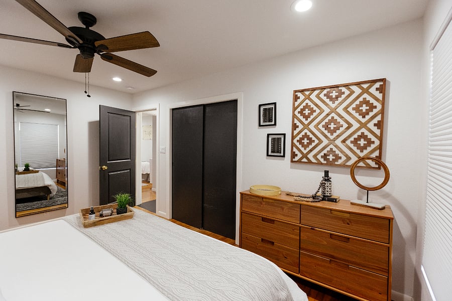 Primary bedroom with closet & extra linens