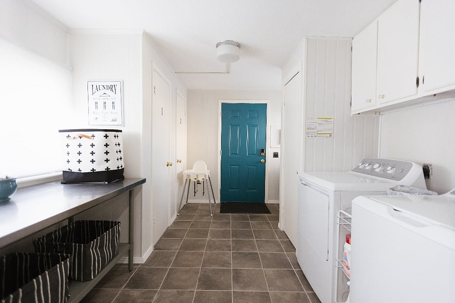Laundry room with washer, dryer, and folding table 