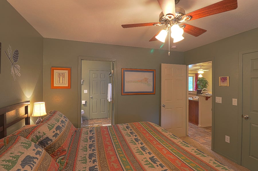 The main bedroom is next to the main bathroom and kitchen.