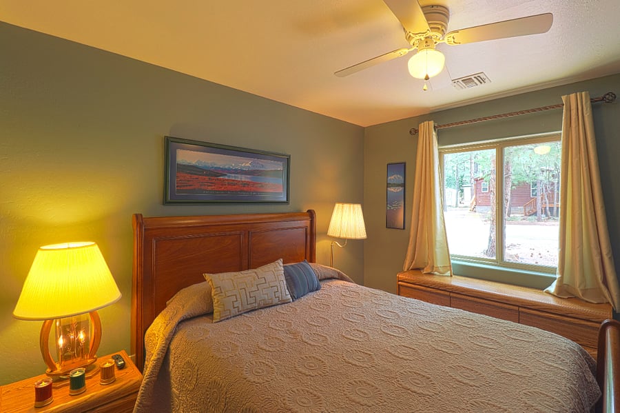 The second bedroom is bright with a nice view outside. The curtains are room-darkening.