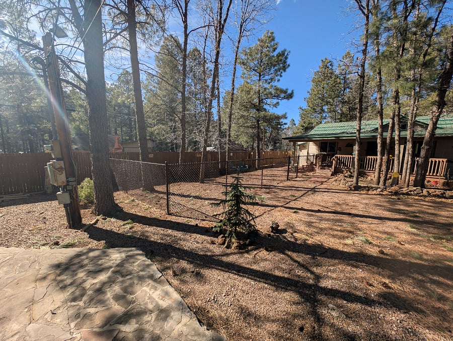 Large dog run added to back yard.