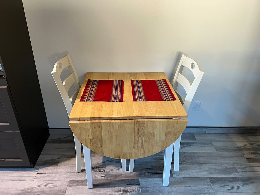 An expandable table can be used for dining or as a workstation.