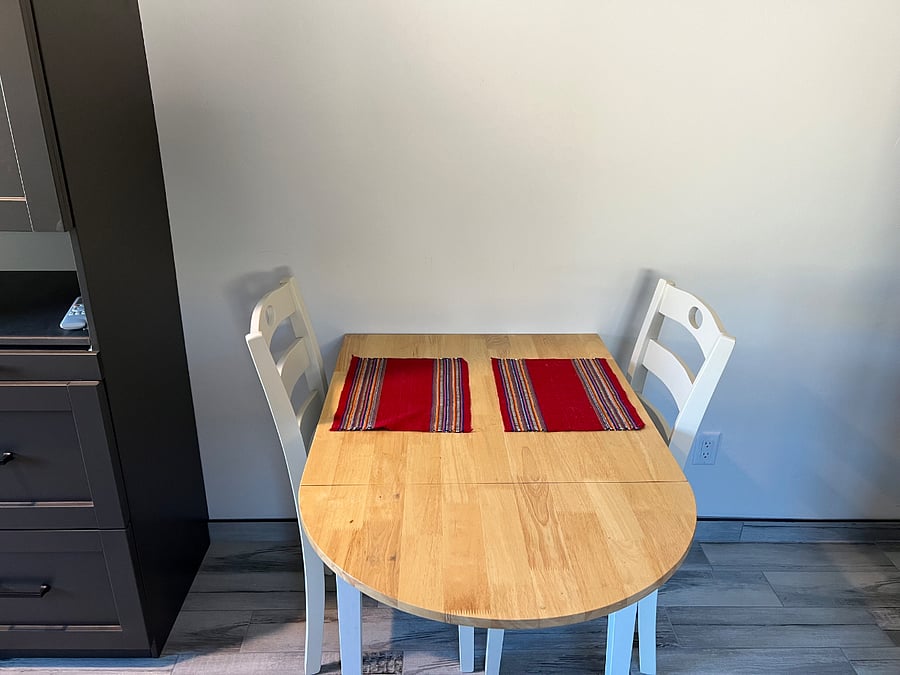An expandable table can be used for dining or as a workstation.
