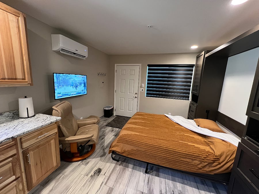 Zebra shades feature alternating sheer and opaque fabric bands, allowing for customized light control. Users can easily adjust the alignment of these bands to transition between light filtering and complete blackout. These shades provide effective privacy management without completely blocking natural light.