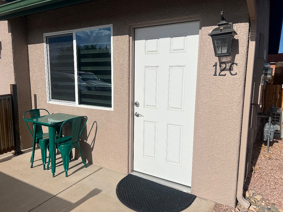 Small privacy screened patio with table and chairs. Enjoy morning coffee with enough privacy, but friendly enough to enjoy the scenery. 
