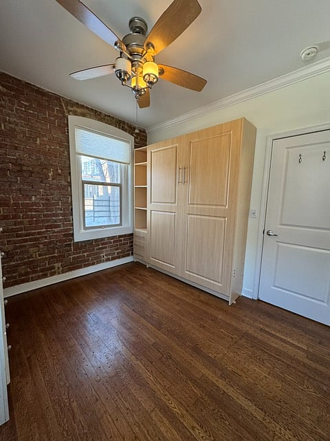 Queen size Murphy bed stowed. Easy to pull down with spring load assist. Bedside storage shelves and drawers. Built-in LED lights for night-time reading.