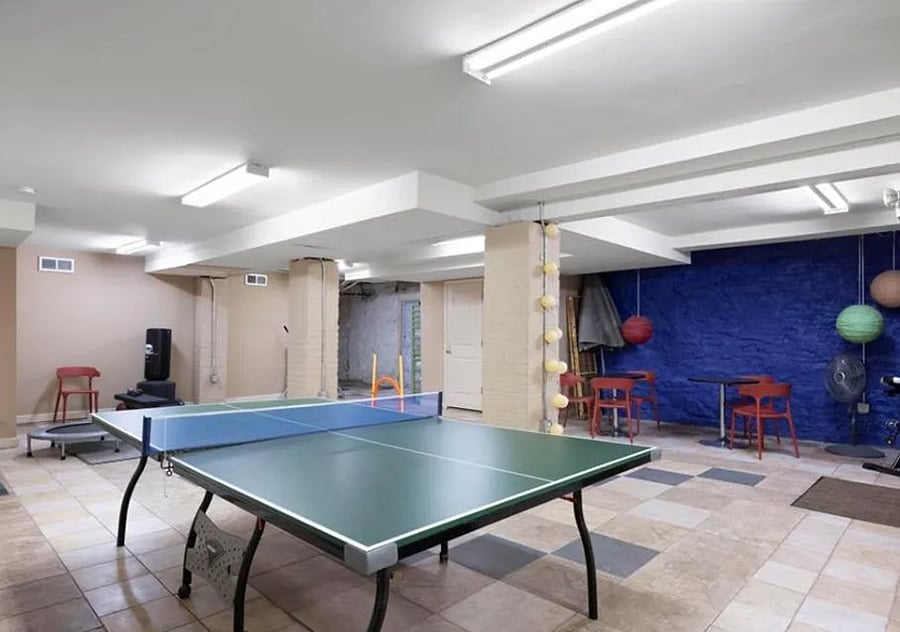 Basement common area has treadmill and more.