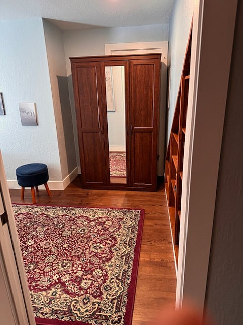 Full size wardrobe with closet. Stool opens for extra storage.
