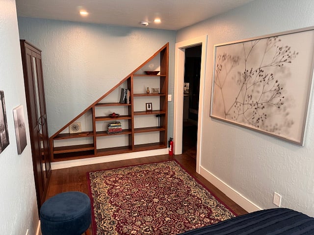 Bedroom with built-in shelves.