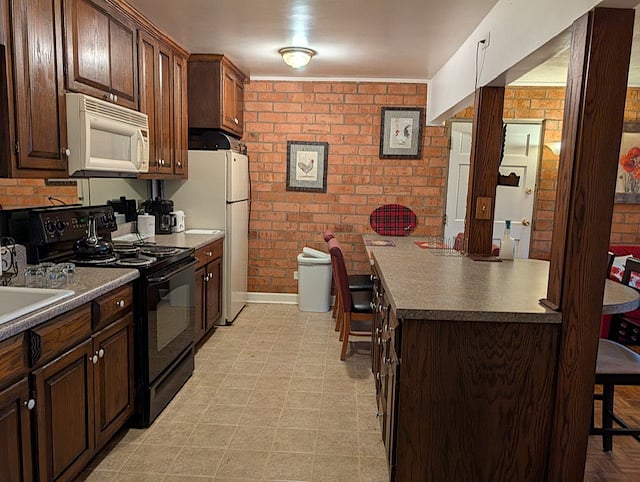 Galley kitchen with all cookware and dishware stocked and ready
