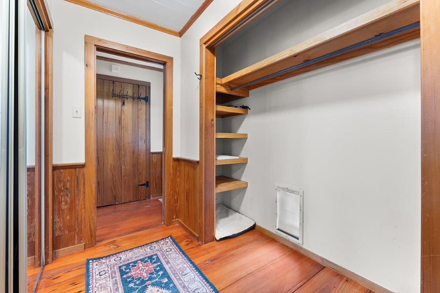 Area suitable for dog bedding with access to back porch and secure dog run.