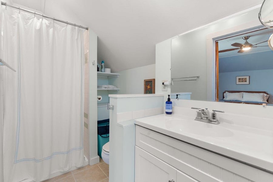 Bathroom with shower in North bedroon - antique stained glass door,