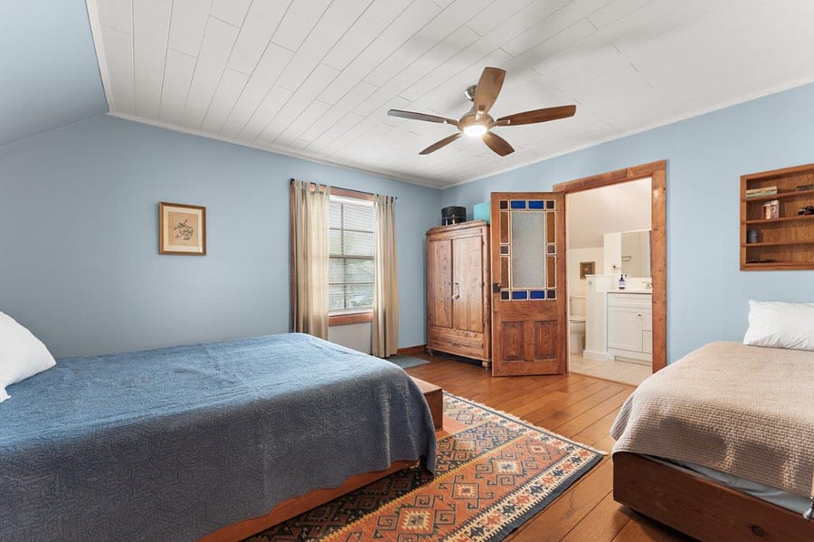 North bedroom with queen bed and single bed, Light blocking curtains.