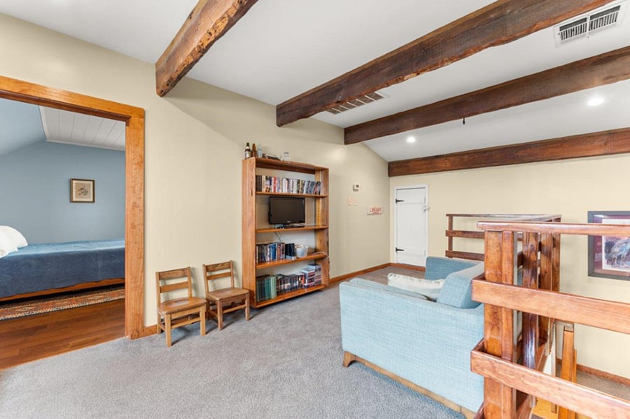 Upstairs landing with wooden beams salvaged from old church.