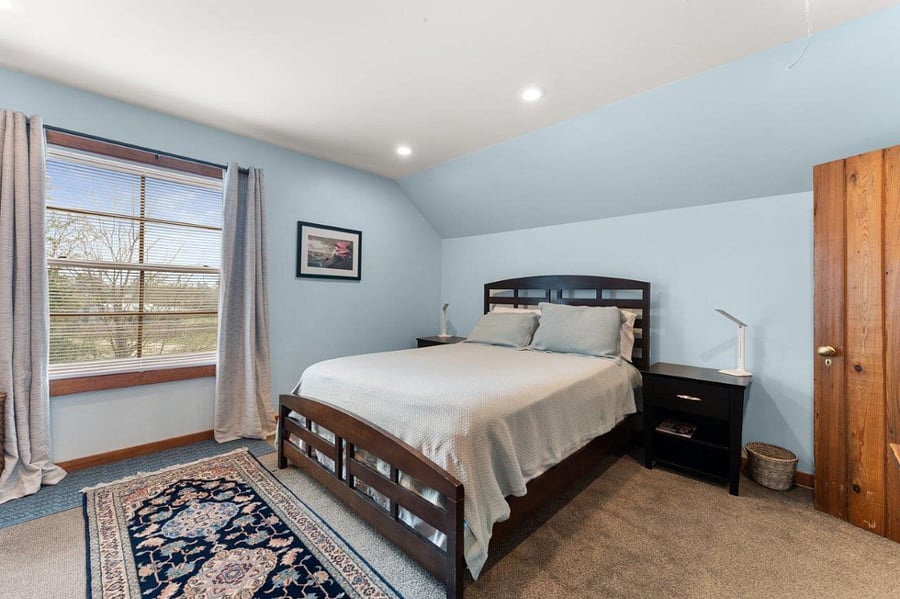 South bedroom with Queen bed and light blocking curtains.