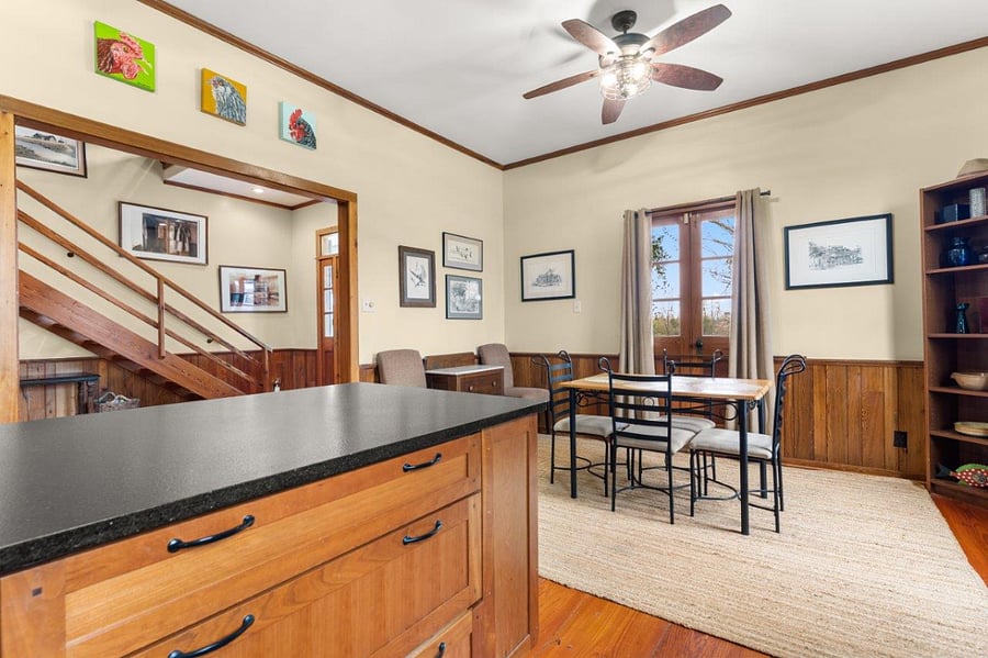 View of open staircase from Kitchen.