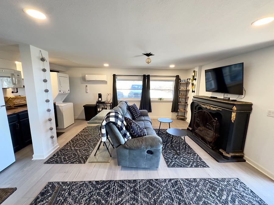 spacious living area with reclining couch