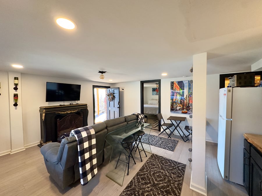 spacious living area with reclining couch