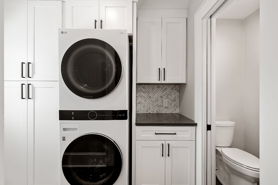 Full laundry, adjacent to power room / half bathroom