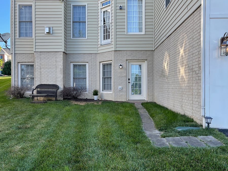 Private entrance on back side of the home; Private yard (no fence, lawn service included). Walk way leads from 1 included driveway parking space to tenant's private door (with key pad entry code). Notice the windows - there are 5; the apartment has a lot of natural light.