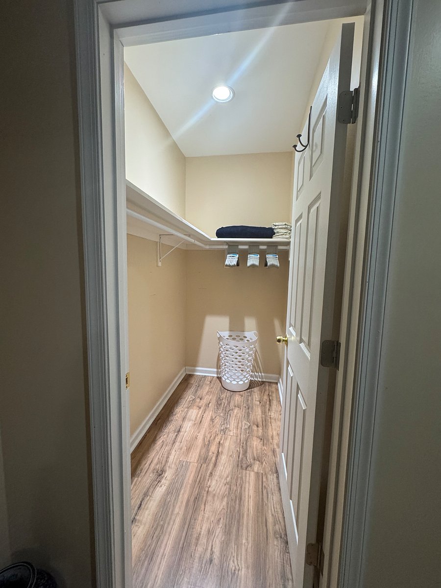 Bedroom #1 Closet: Walk-in with hamper, hangers, extra blanket, and extra linen
