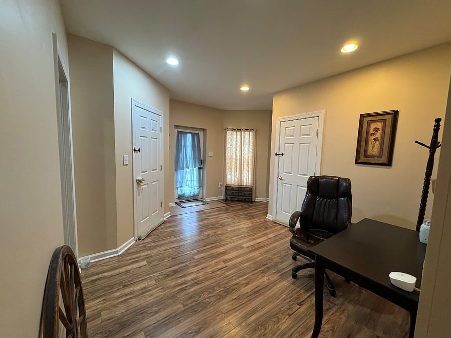 Interior view of front door and foyer. The two close doors lead to stairways to the main/owner's level (for tenant and owner privacy and security, the doors are locked on both the owner and tenant's side and are alarmed).