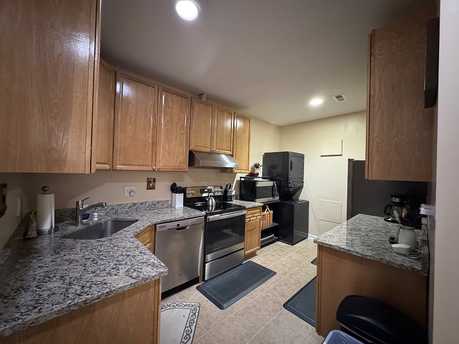 Kitchen (view 1); Dishwasher, oven, stove, French door refrigerator, large microwave, and stacked washer/dryer
Photos of furnished small appliances and kitchen essentials shown later in listing