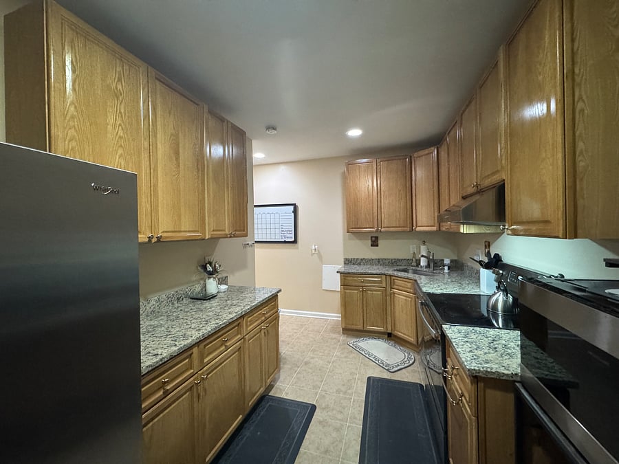 Kitchen (view 5); Reverse view; Second Eero mesh pod located in kitchen for optimal WIFI coverage across apartment