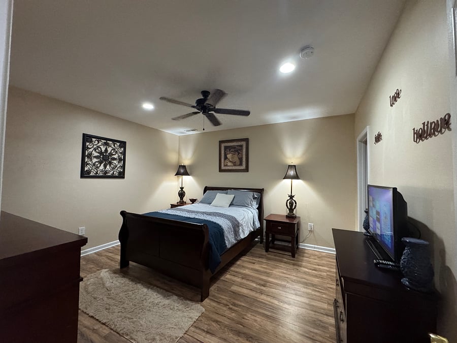 Bedroom #1 (view 1); Queen bed; 3-speed ceiling fan, recessed lights, two lamps, two nightstands, two dressers