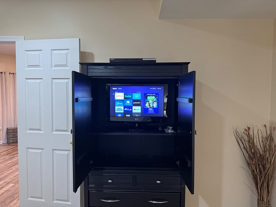 Bedroom #2; Small flat screen TV inside armoire with HD Roku stick and DVD player